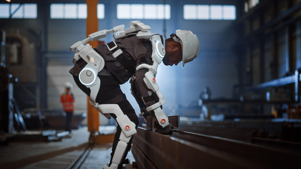 A robotic exoskeleton aiding a human that is performing heavy manual labor.
